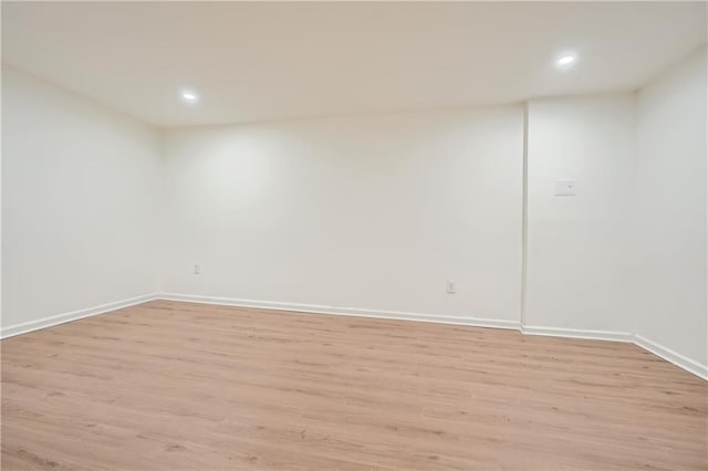 unfurnished room with light hardwood / wood-style floors