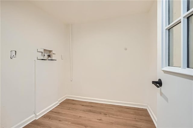 laundry area with hardwood / wood-style flooring and washer hookup