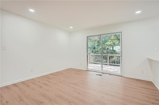 unfurnished room featuring light wood-type flooring