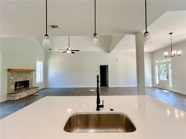 kitchen featuring decorative light fixtures, a healthy amount of sunlight, and sink