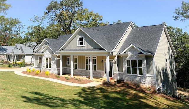 craftsman house with a front lawn