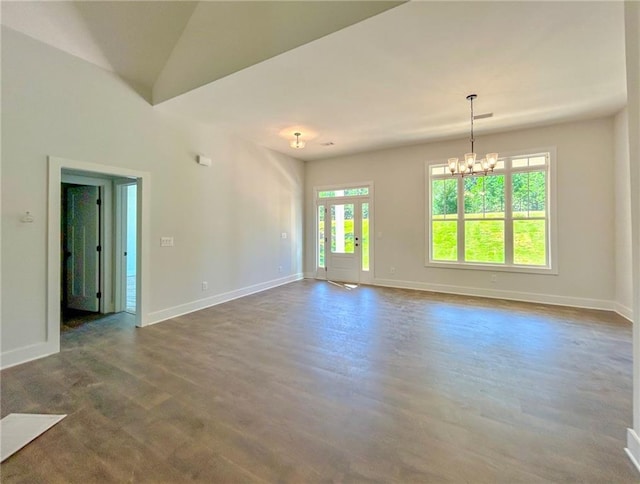 empty room featuring an inviting chandelier