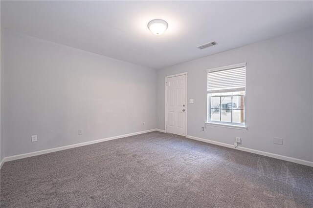 empty room featuring carpet flooring