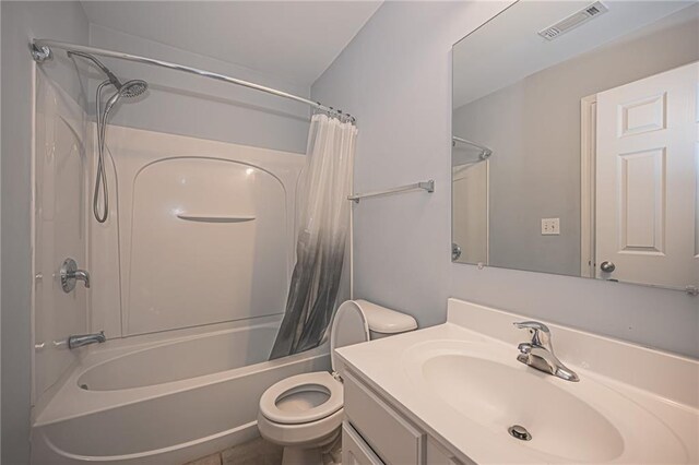 full bathroom featuring shower / bathtub combination with curtain, toilet, and vanity