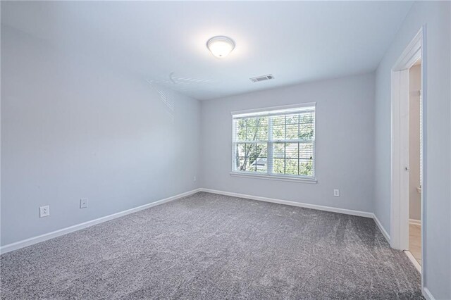 unfurnished room with carpet