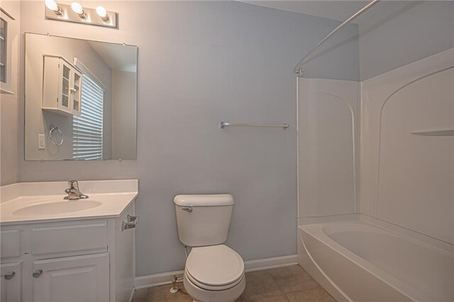 full bathroom with bathtub / shower combination, tile patterned flooring, vanity, and toilet