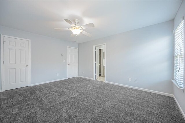 carpeted empty room with ceiling fan