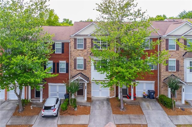 multi unit property featuring a garage