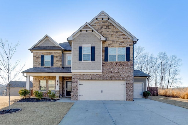 view of front of property featuring a garage and a porch