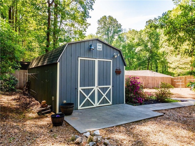 view of shed with fence