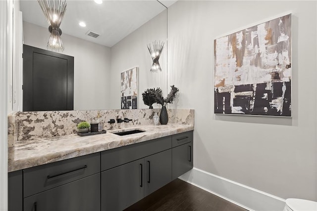 bathroom featuring hardwood / wood-style flooring and vanity