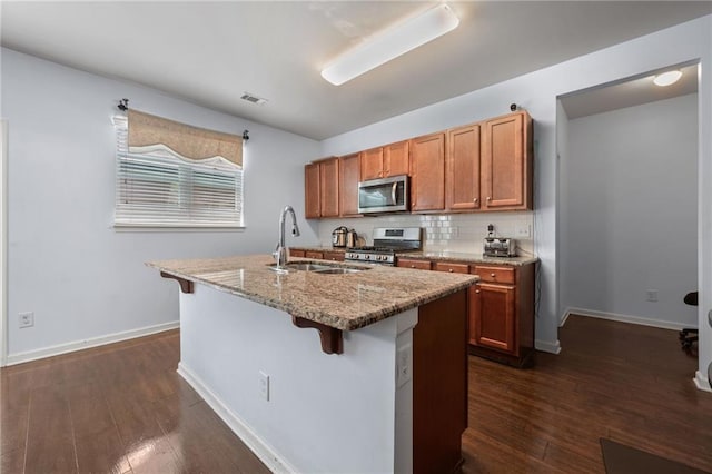 1612 Nations Trl, Riverdale, GA 30296 - kitchen featuring visible vents, a sink, dark wood-style floors, and stainless steel appliances