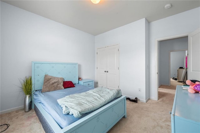 1612 Nations Trl, Riverdale, GA 30296 - bedroom with light colored carpet, baseboards, and a closet