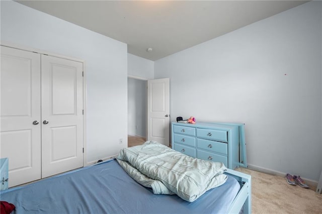1612 Nations Trl, Riverdale, GA 30296 - bedroom with baseboards, a closet, and light carpet