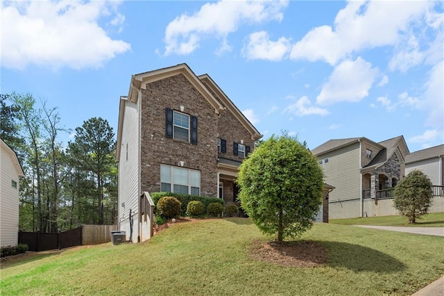 1612 Nations Trl, Riverdale, GA 30296 - view of front of house with brick siding, a front lawn, central AC, and fence