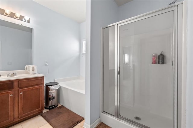 1612 Nations Trl, Riverdale, GA 30296 - bathroom with vanity, tile patterned flooring, a garden tub, and a stall shower