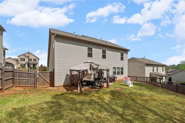 1612 Nations Trl, Riverdale, GA 30296 - rear view of property featuring a gazebo, a gate, a lawn, and a fenced backyard