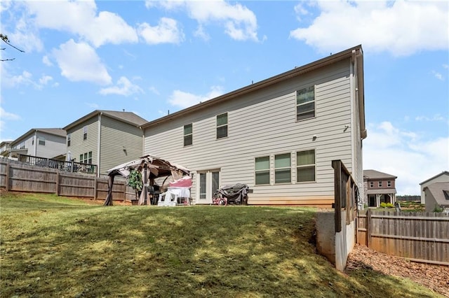 1612 Nations Trl, Riverdale, GA 30296 - back of house featuring a fenced backyard and a lawn