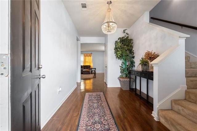 1612 Nations Trl, Riverdale, GA 30296 - foyer entrance featuring visible vents, dark wood-style flooring, a notable chandelier, and stairway