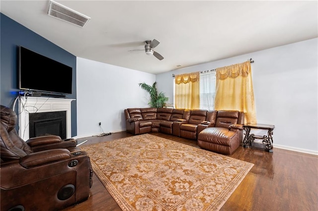1612 Nations Trl, Riverdale, GA 30296 - living room with ceiling fan, a fireplace, baseboards, wood finished floors, and visible vents