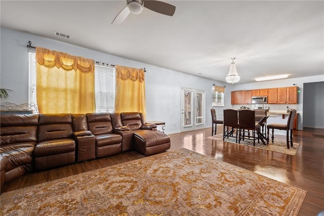 1612 Nations Trl, Riverdale, GA 30296 - living area with baseboards, ceiling fan with notable chandelier, wood finished floors, and visible vents