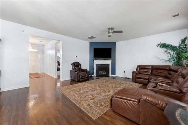 1612 Nations Trl, Riverdale, GA 30296 - living area with a glass covered fireplace, ceiling fan, dark wood-style flooring, and visible vents