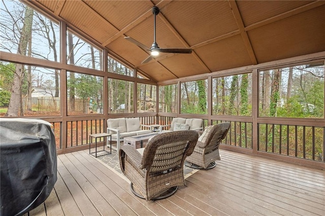 sunroom with ceiling fan, wooden ceiling, and vaulted ceiling