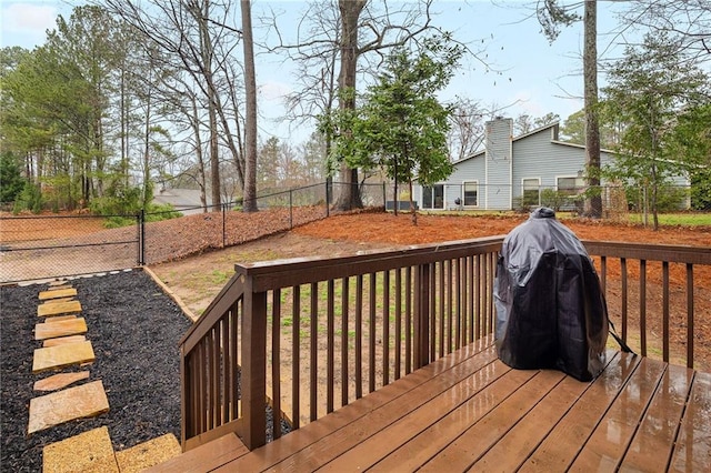 wooden terrace featuring a fenced backyard