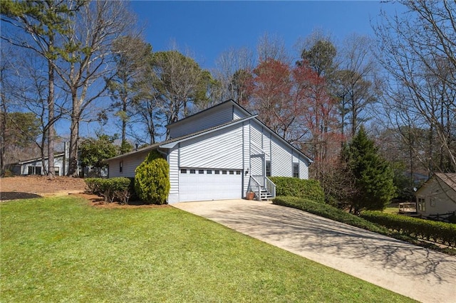 view of side of home featuring a yard and driveway