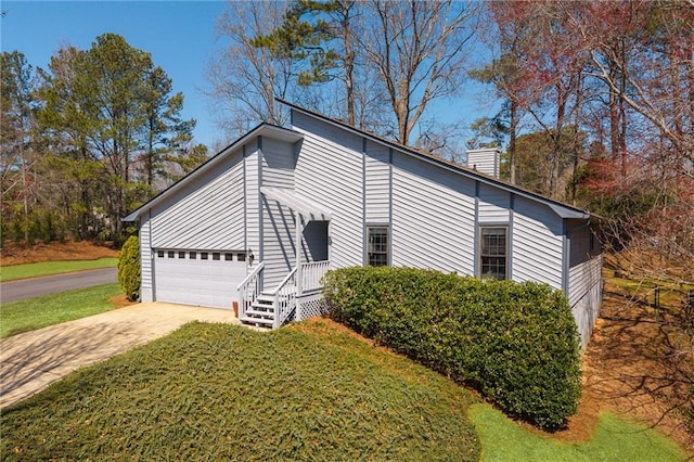 view of property exterior featuring a lawn, an attached garage, concrete driveway, and a chimney