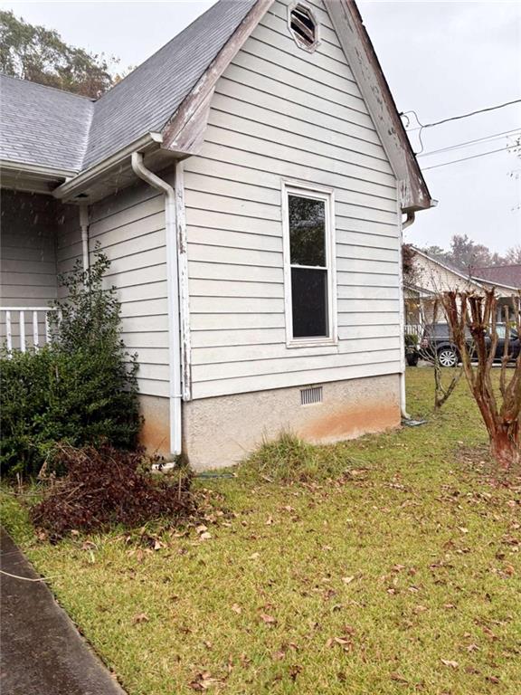 view of home's exterior featuring a yard