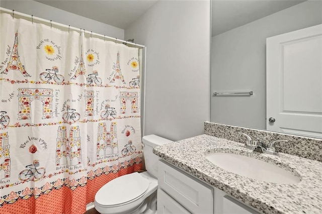 bathroom featuring vanity, a shower with curtain, and toilet