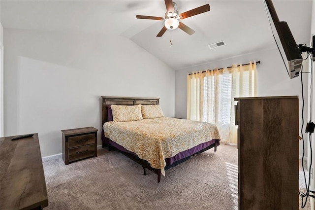 bedroom featuring carpet floors, vaulted ceiling, and ceiling fan