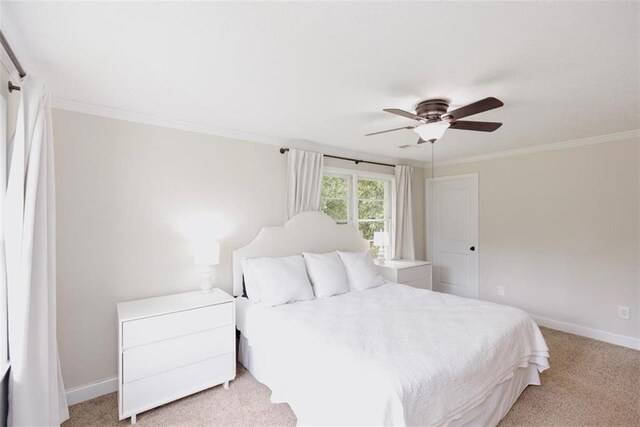 1233 Bethlehem Rd, Statham, GA 30666 - bedroom featuring light colored carpet, crown molding, baseboards, and ceiling fan