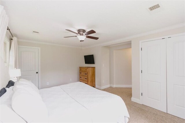 1233 Bethlehem Rd, Statham, GA 30666 - bedroom featuring ornamental molding, light colored carpet, baseboards, ceiling fan, and a closet
