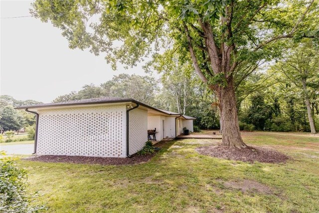 1233 Bethlehem Rd, Statham, GA 30666 - view of side of property with a yard