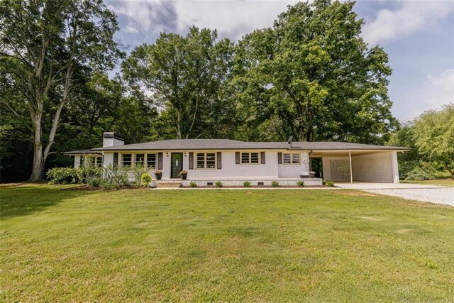 1233 Bethlehem Rd, Statham, GA 30666 - ranch-style home with gravel driveway, an attached carport, a chimney, and a front lawn
