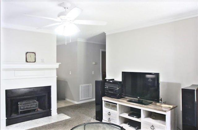 living area featuring a fireplace with flush hearth, crown molding, visible vents, and carpet floors