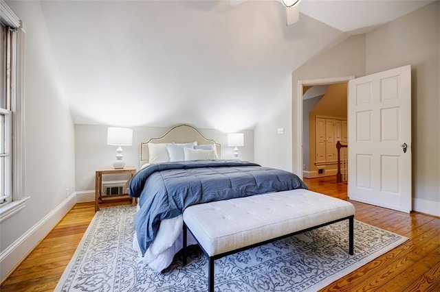 2007 Mount Vernon Pl, Dunwoody, GA 30338 - bedroom with vaulted ceiling, light wood-style floors, and a ceiling fan