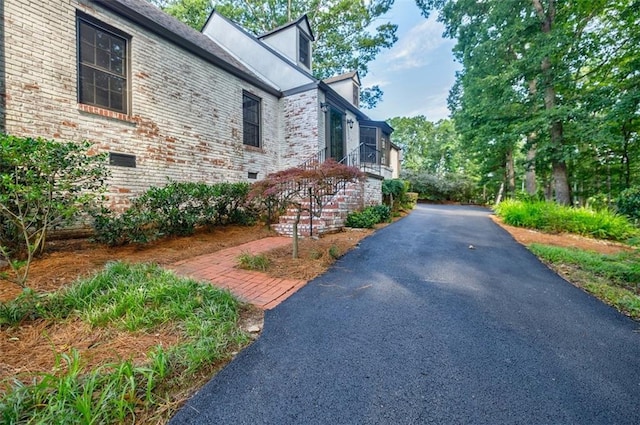 2007 Mount Vernon Pl, Dunwoody, GA 30338 - view of property exterior featuring brick siding and asphalt driveway