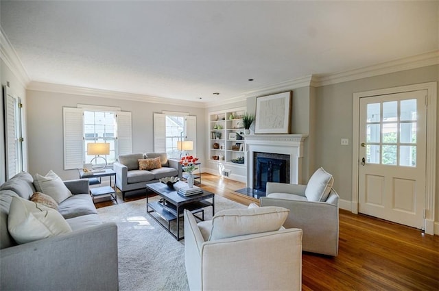2007 Mount Vernon Pl, Dunwoody, GA 30338 - living area featuring wood finished floors, crown molding, plenty of natural light, built in shelves, and a fireplace with flush hearth