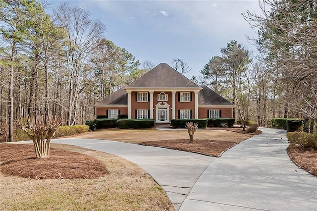 greek revival house with brick siding