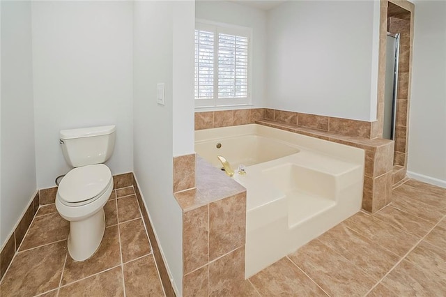 full bathroom featuring tile patterned floors, toilet, a garden tub, and tiled shower