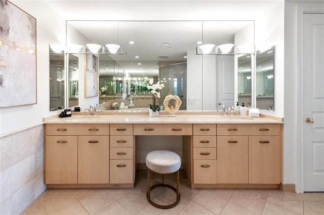 bathroom with vanity, tile patterned flooring, and walk in shower