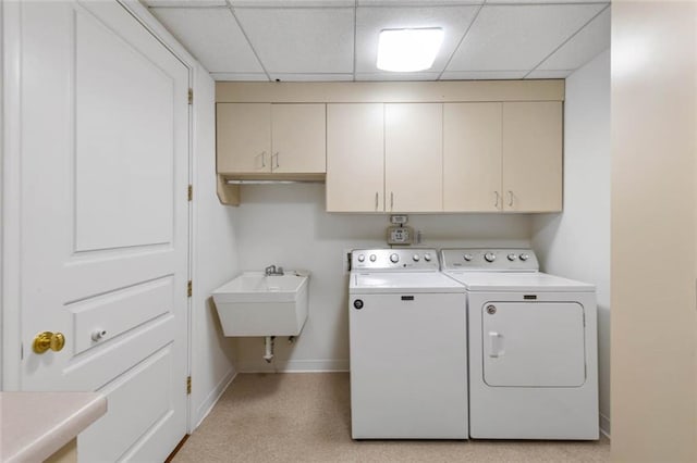 laundry room with cabinets, sink, and independent washer and dryer