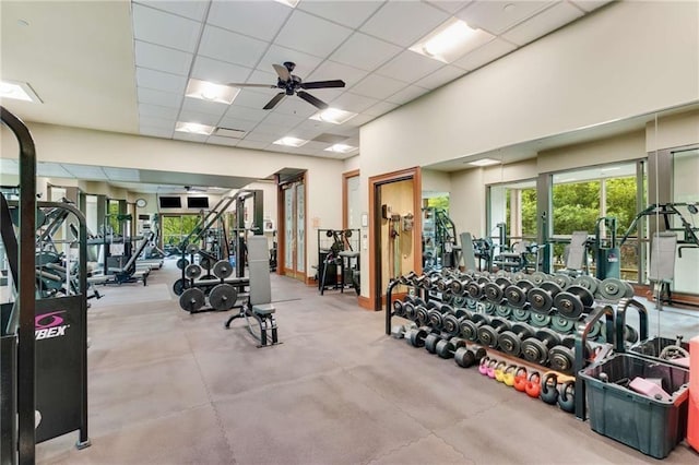 gym featuring a paneled ceiling and ceiling fan