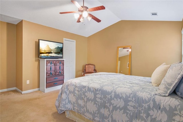 bedroom featuring carpet, visible vents, a ceiling fan, vaulted ceiling, and baseboards