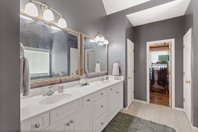 bathroom with tile patterned floors and vanity