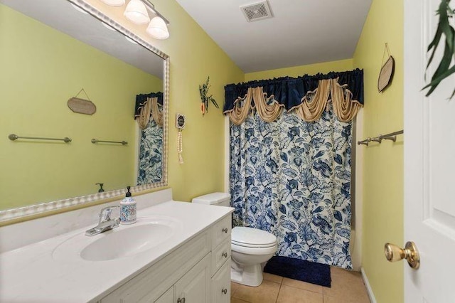 bathroom with tile patterned flooring, a shower with curtain, vanity, and toilet