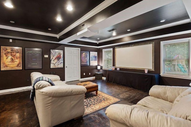 home theater with a raised ceiling, dark hardwood / wood-style flooring, and crown molding